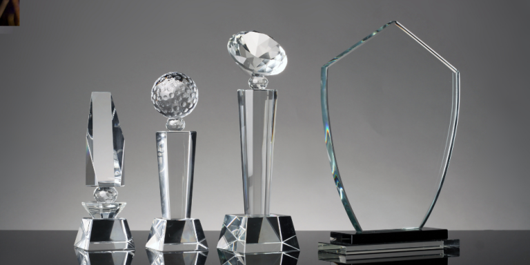How to Choose Between Crystal, Acrylic, and Wood Trophies for Corporate Awards
